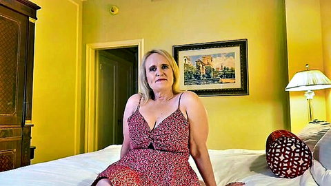 Curvy blonde MILF with huge tits in low-cut floral dress during casting