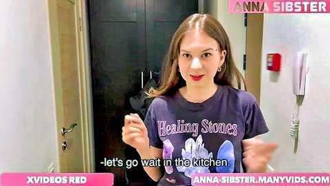 Anna Sibster in casual purple Healing Stones t-shirt, gesturing playfully