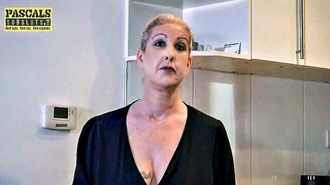 British MILF Primal Moon in low-cut black dress showing cleavage