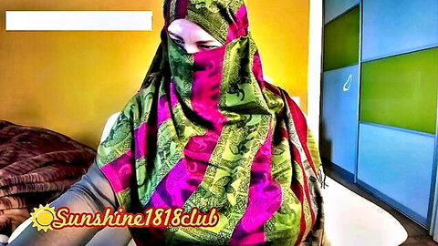Arab Muslim woman in colorful hijab teasing ass in jeans on cam