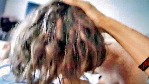 Amateur maid with wavy hair on bed after cleaning turns to sex