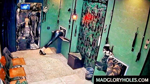 Woman in tight leather pants and heels at glory hole setup in Secret Fucking Mission
