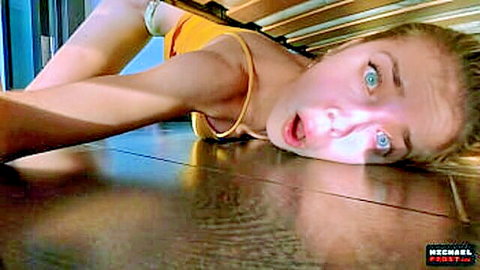 Surprised blonde stepsister stuck under bed in yellow top, exposed body