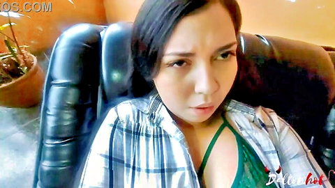 Asian amateur in open plaid shirt revealing green bra, sultry gaze on rainy day tease