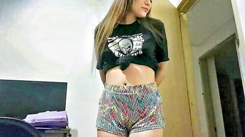 Horny stepsister in crop top and short shorts teasing in bedroom
