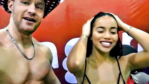 Victoria June with huge tits and ass poses with muscular man in sexy black top