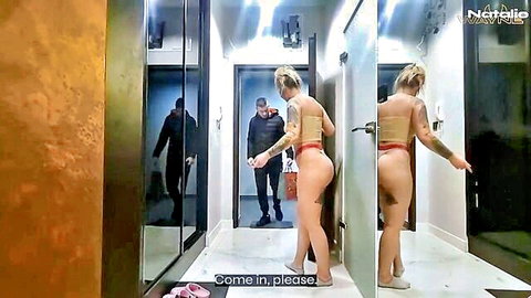 Natalie Wayne in red thong teases men in hallway on birthday