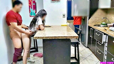 Asian petite girl sits on step-uncle's lap eating, explicit rear contact