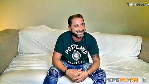 Smiling bearded man in Portland t-shirt and ripped jeans, teasing busty shy teen slut scene