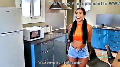 Mariana Martix teases in orange crop top and denim shorts