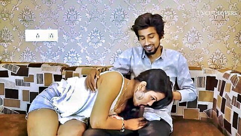 Hot Indian girl in tank top and shorts lies intimately in man's lap