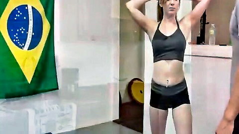Daisy Chainz in tight sports bra and shorts, wrestling playfully