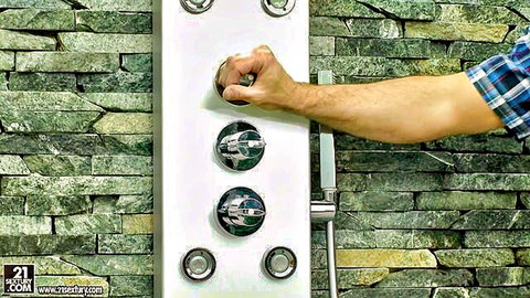 Halona Vog adjusting shower controls in steamy bathroom scene