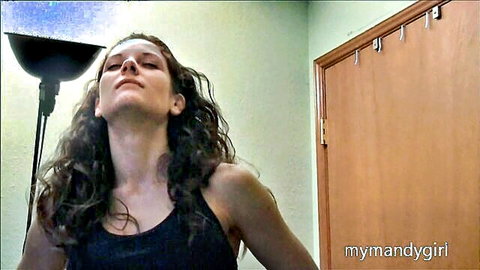 Mandy Flores seductive pose in black tank top, head tilted back
