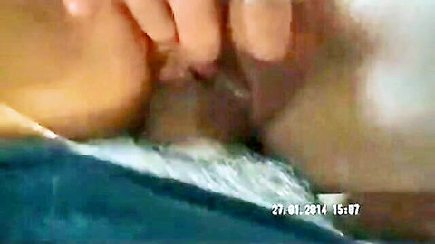 Close-up of wet pussy lips spread by fingers, amateur solo view
