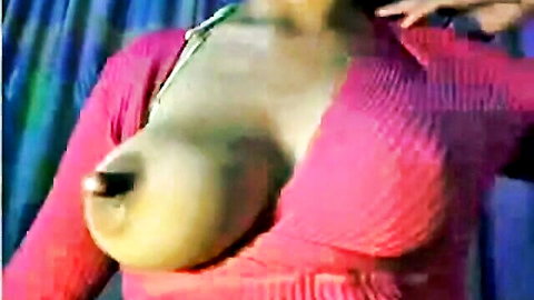 Busty MILF's massive big tits with huge erect nipples bulging through sheer pink sweater