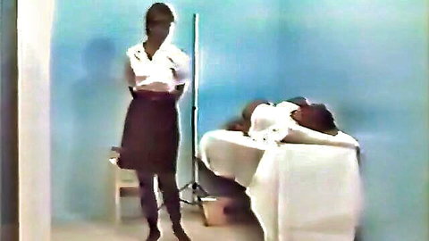 Black prison guard in uniform skirt and stockings punishes inmate