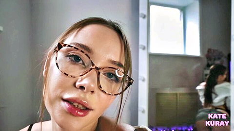 Kate Kuray close-up in stylish glasses, seductive gaze