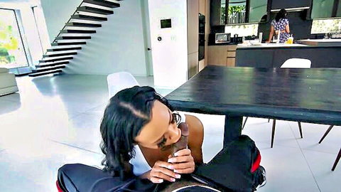 Ebony babe kneels in kitchen gripping thick black cock ready for blowjob