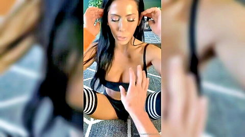Madison Ivy in black lingerie and striped socks adjusting headphones