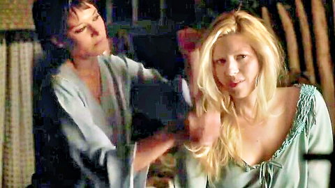 Katheryn Winnick in intimate lesbian hair styling with blonde in green dress