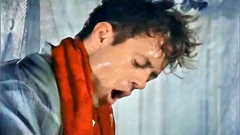 Sweaty man in red scarf shows ecstasy in Erotic Adventures of Marco Polo