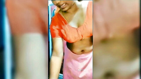 Curvy Tamil woman in red blouse and pink saree, teasing cleavage and navel