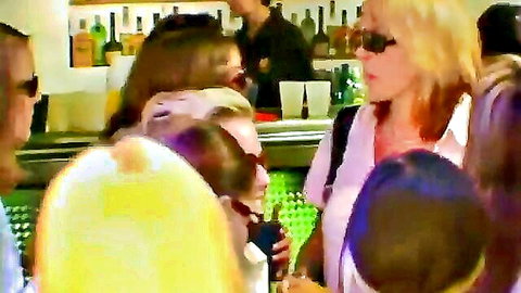 Blonde women in sunglasses partying at club bar with drinks, ultra wet vibe