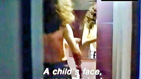 Clio Goldsmith topless with breasts exposed in Heat of Desire