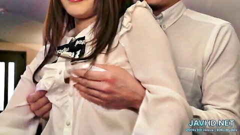 Japanese woman in ruffled white blouse groped by man from behind