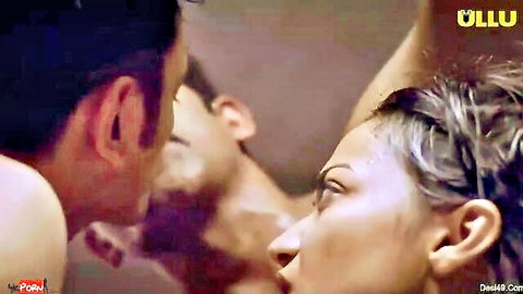 Indian woman in intense closeup threesome stare with two men, naked shoulders teasing passion