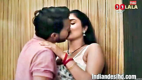 Indian bhabhi passionately kissing husband in romantic embrace