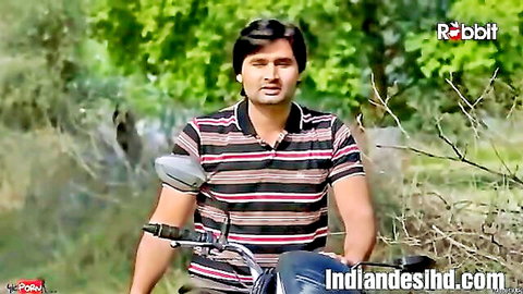 Indian man in striped polo on motorcycle outdoors, Bhabhi Ka Bhokal 2023 adult series thumbnail