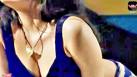 Seductive Indian bhabhi in low-cut blue top with deep cleavage