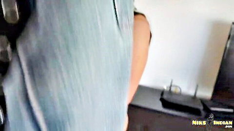 POV closeup of Indian girl's big ass in tight blue pants bending over desk