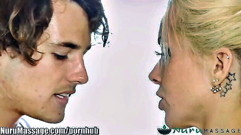 Blonde stepmom and stepson in intimate close-up during nuru massage