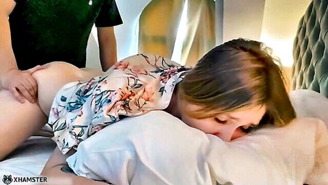 Stepmom begs for creampie in hotel room, man gropes her exposed ass on bed