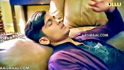 Young Desi man lounging seductively on couch in purple jacket, Khidki 01 teaser
