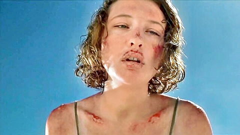 Distressed curly-haired Japanese woman with facial bruises in BDSM scene