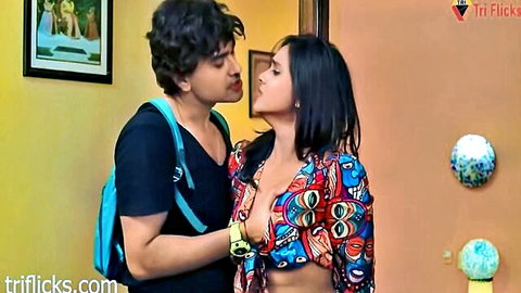 Indian MILF in open colorful blouse embracing curly-haired man intimately