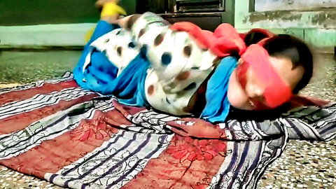 Blindfolded bound brunette in colorful saree lying barefoot on floor amateur BDSM