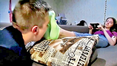 Amateur boy worships mistress's socked feet in BDSM foot fetish scene