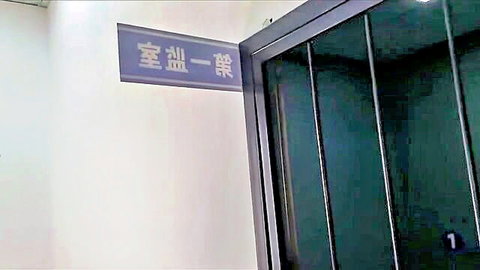 Chinese prison BDSM setup with barred cell door thumbnail