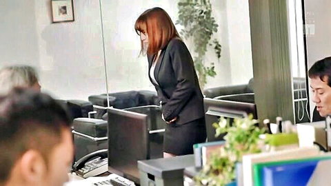 Asian office woman in tight black skirt and blazer, professional attire