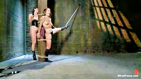 Bobbi Vai bound nude in BDSM with stockings and dominatrix