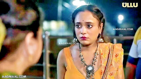 Indian woman in orange saree looking upset in emotional Ullu web series scene
