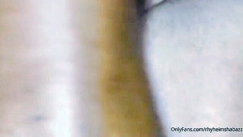 Blurry close-up of bearded man in gay bareback anal scene