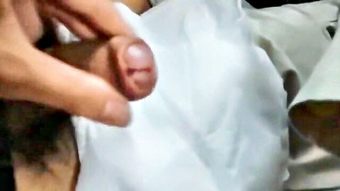 Close-up of hand helping Chinese teen masturbate in gay porn