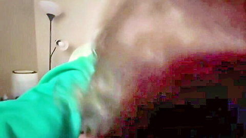 MILF in green hoodie challenges head game skills in bedroom blowjob