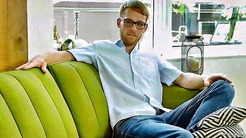Calhoun Sawyer lounging in white shirt and jeans, gay porn preview
